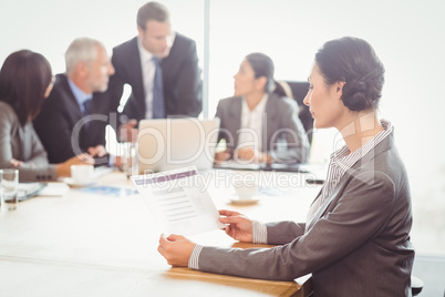 Businesswoman reading a report