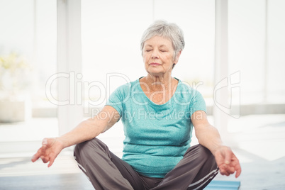 Woman performing yoga at home