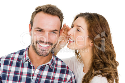 Woman whispering into mans ears