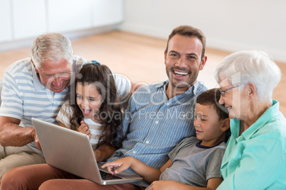 Happy family sitting on sofa