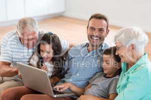 Happy family sitting on sofa