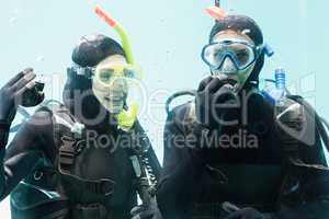 Couple practicing scuba diving together
