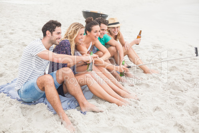 Group of friend taking a selfie on the beach
