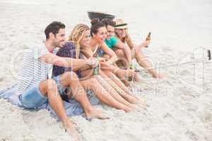 Group of friend taking a selfie on the beach