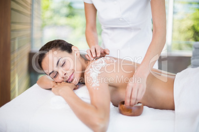 Young woman enjoying spa treatment