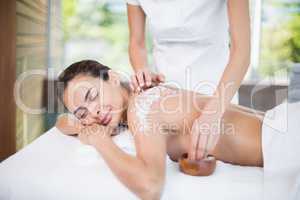 Young woman enjoying spa treatment