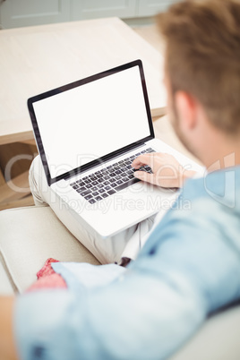 Man using laptop at home