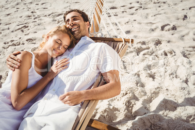 Couple sleeping in hammock