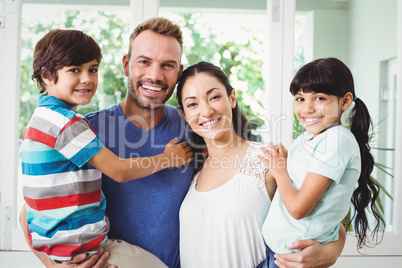 Portrait of confident family with children