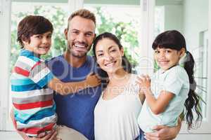 Portrait of confident family with children