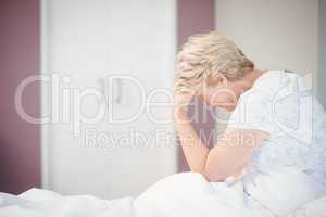 Senior woman suffering from headache