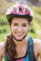 Smiling woman wearing a helmet