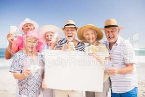 Senior friends holding blank paper and money