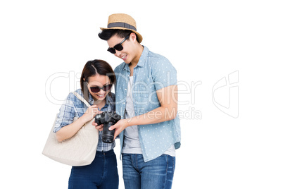 Happy young couple looking in camera