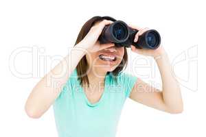 Young woman looking through binoculars