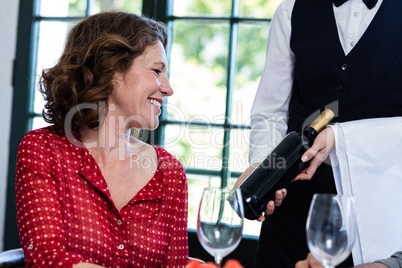 Woman selecting a bottle of wine