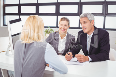 Bbusiness people discussing with client