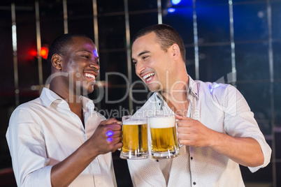 Handsome men drinking together