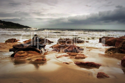 Stormy Beachfront with Wood Stump