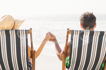 Rear view of couple sitting on armchair