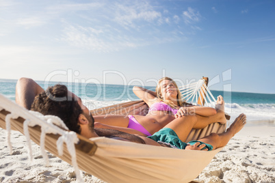 Couple lying in hammock