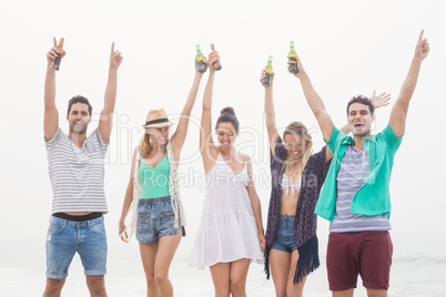 Group of friends holding beer bottle