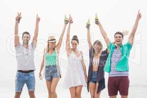 Group of friends holding beer bottle