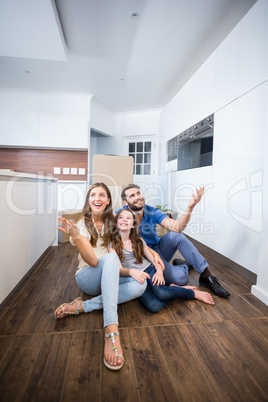 Happy family sitting on floor