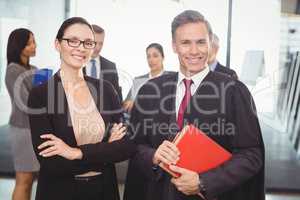 Businesswoman standing with lawyer