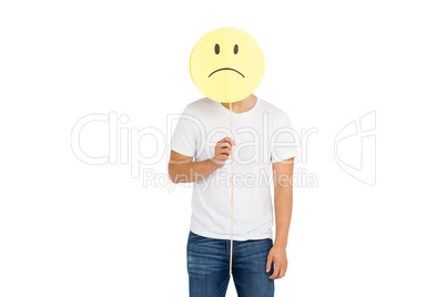 Man holding sad smiley face