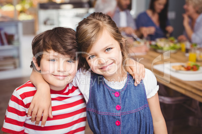 Portrait of brother and sister smiling