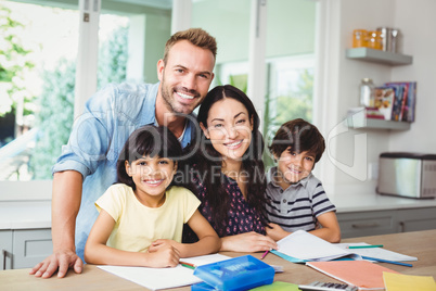 Parents assisting children doing homework