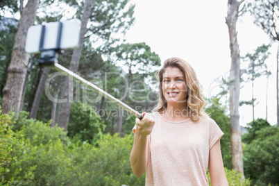 Smiling woman taking selfies