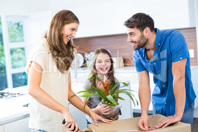 Smiling family packing box