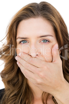 Hand covering young womans mouth