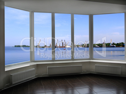 window overlooking the sea port docks and cranes