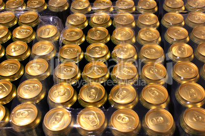 packing of tins of beer