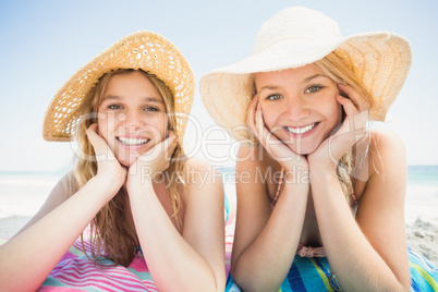 Portrait of happy women lying on the beach