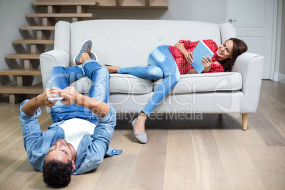 Happy couple using technology