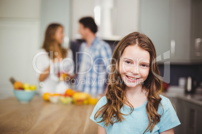 Portrait of smiling girl in kitchen