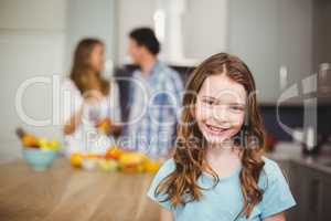 Portrait of smiling girl in kitchen