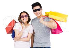 Young couple holding shopping bags