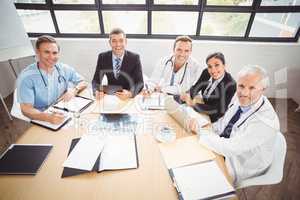 Portrait of happy medical team in conference room
