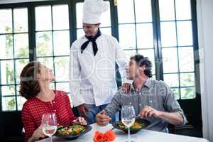 Chef talking to couple
