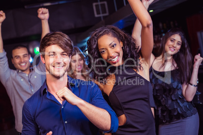 Happy friends dancing together