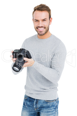 Young man using camera