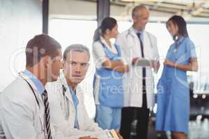 Two doctors with clipboard and discussing