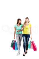 Happy female friends holding shopping bags