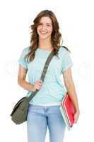 Portrait of young woman holding books