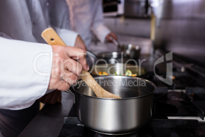 Close-up of chef preparing food